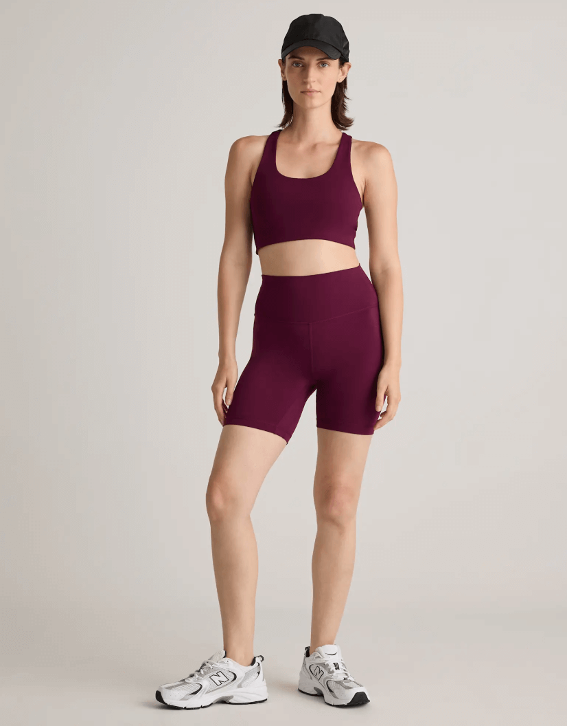 Woman in athletic wear posing athleisure trends
